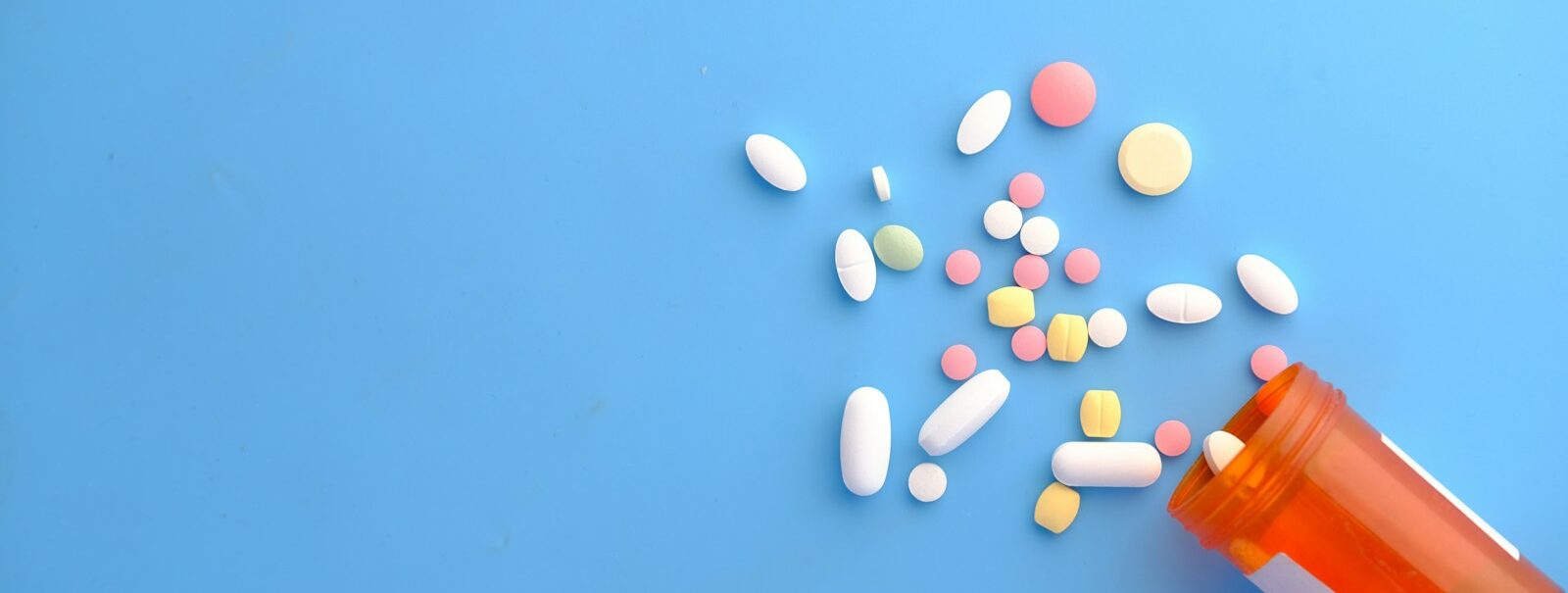 orange and white medication pill